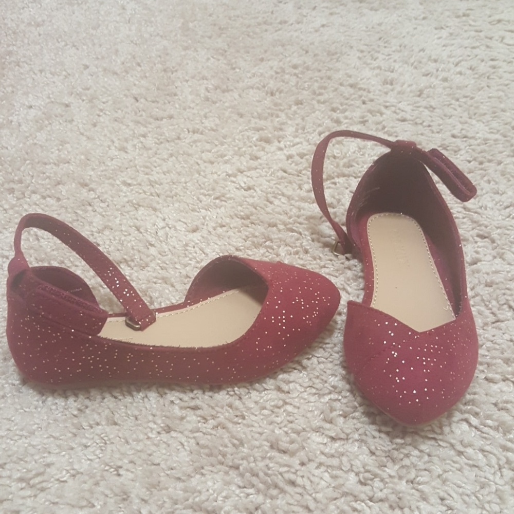 Maroon and gold shoes